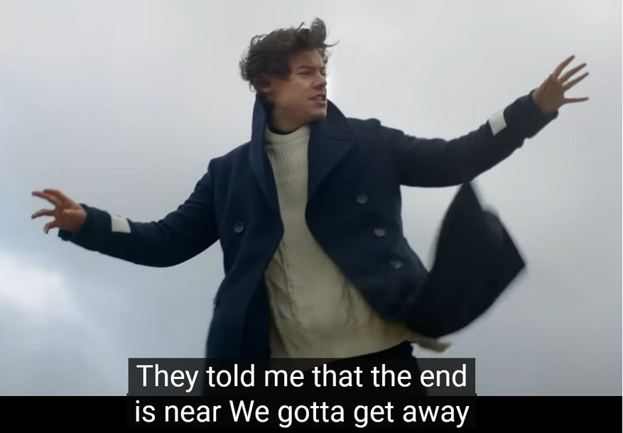 Harry Styles performing on stage